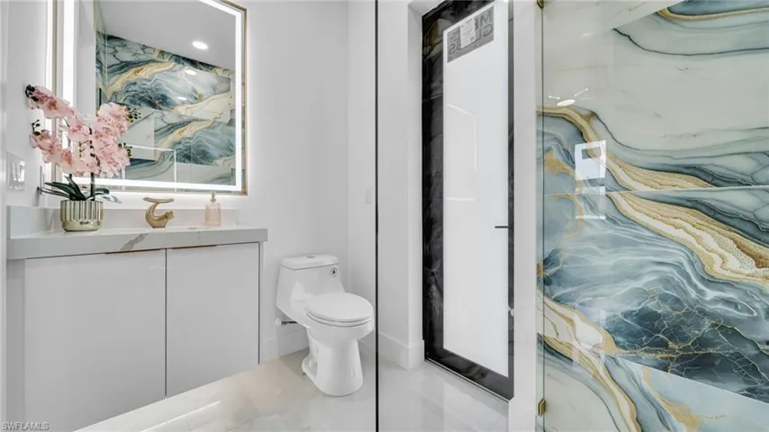 Bathroom featuring vanity and tile patterned flooring