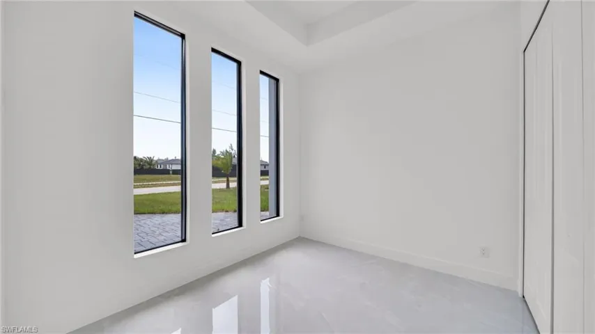 Unfurnished room with baseboards
