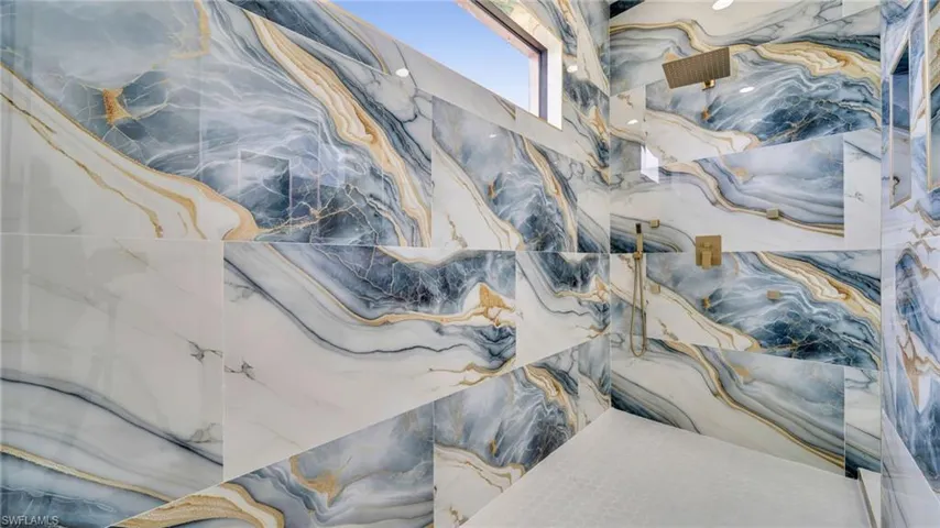 Bathroom view of a marble finish shower