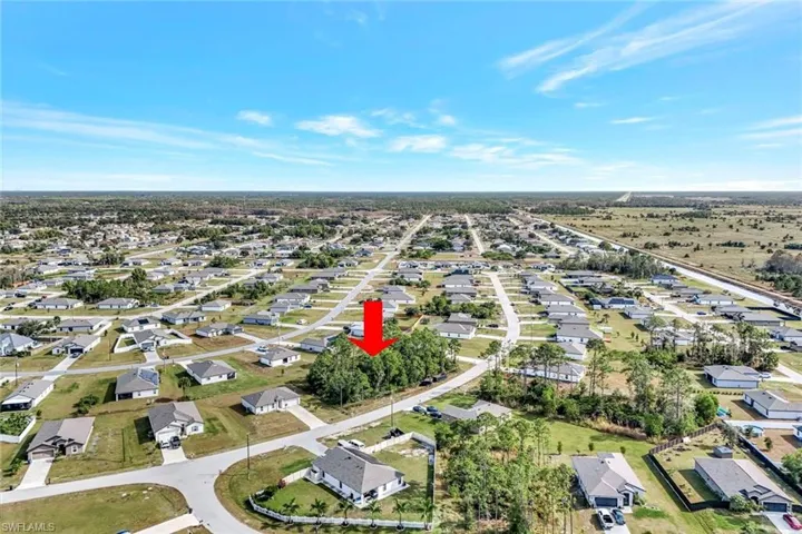 View of property location with nearby suburban area