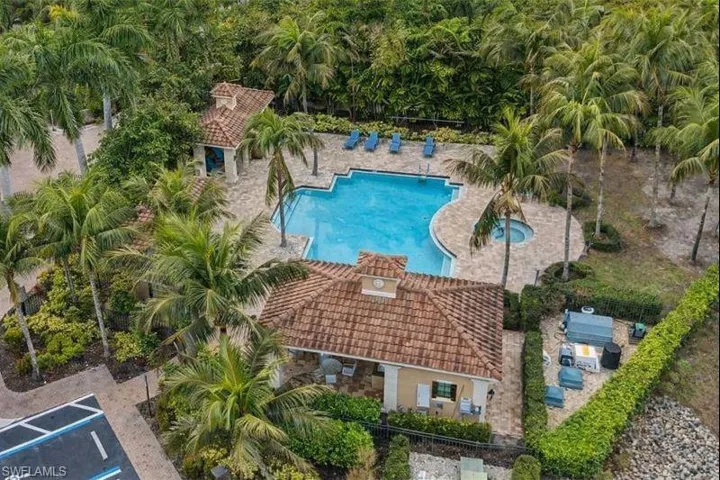 Community pool with a patio area