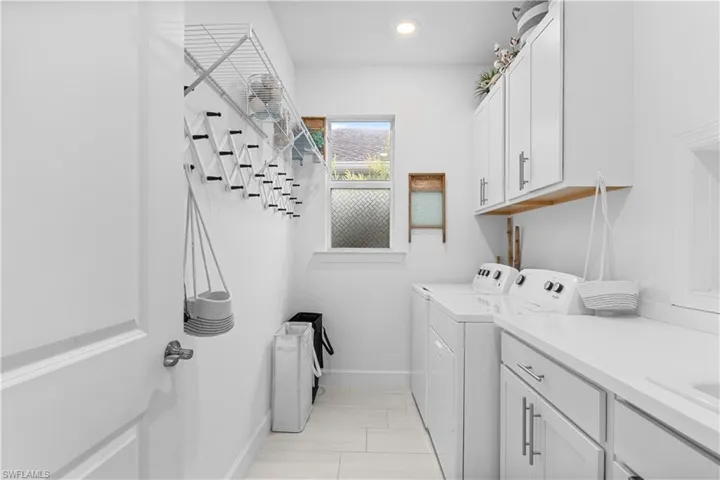 Large laundry with pass through to master BR Closet