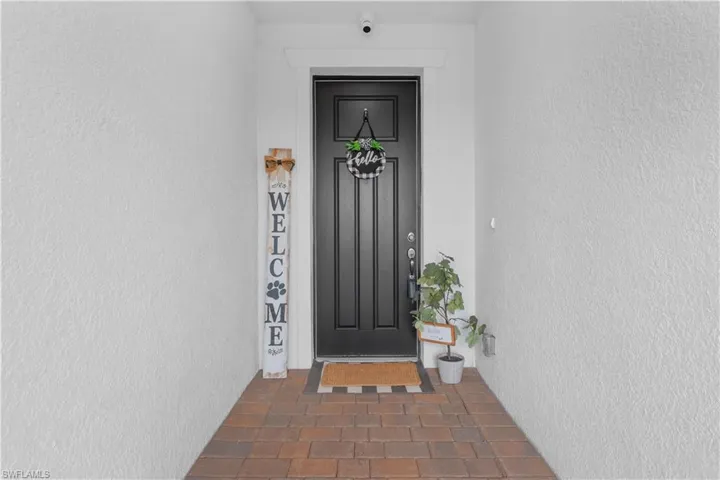Entry with tall screened door to enjoy the breeze