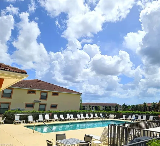 View of swimming pool featuring a grill