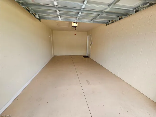 Garage featuring a garage door opener