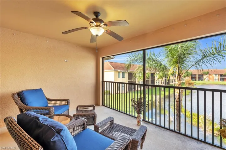 Lanai featuring ceiling fan and a water view