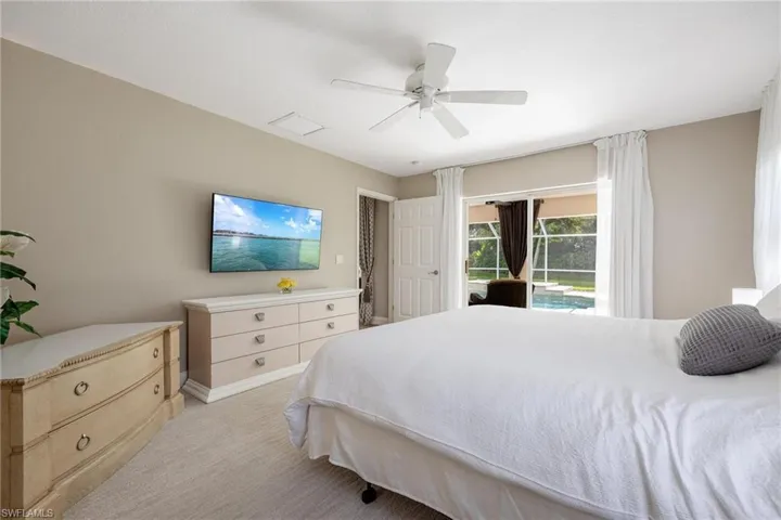 Master Bedroom featuring sliding doors to the pool.