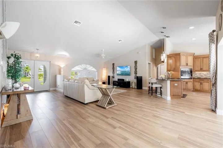 Living room with high vaulted ceiling