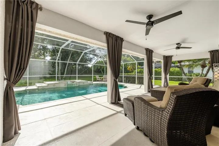 View of pool featuring and covered lanai.