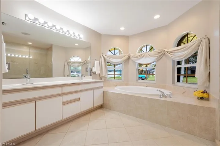 Master Bathroom tiled bath and duel sink vanity
