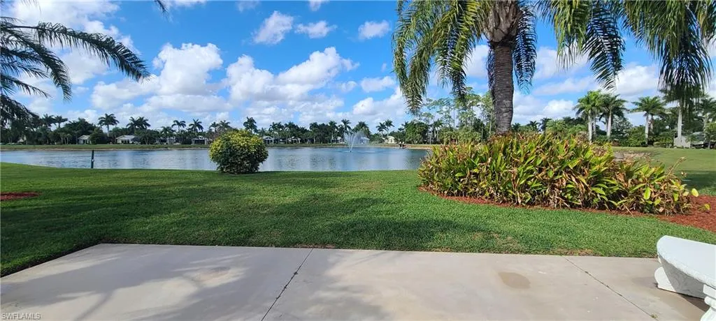 View of yard with a water view