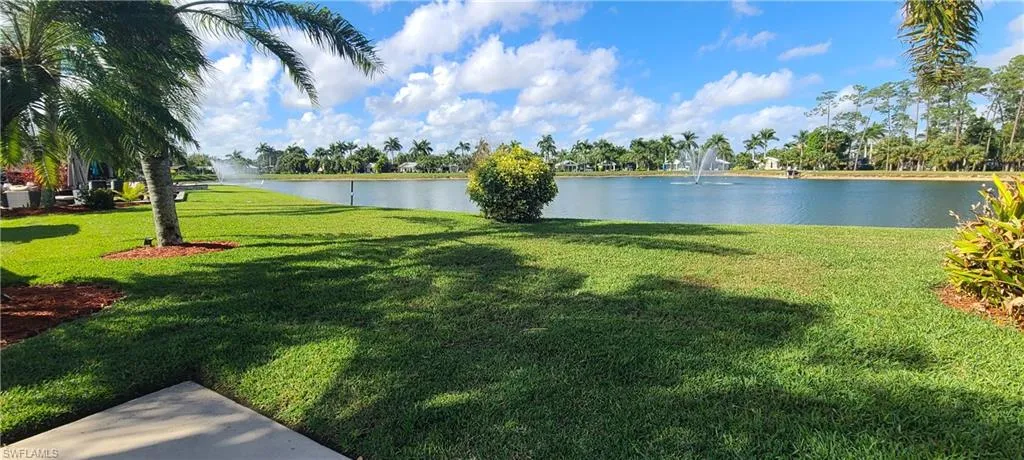 View of yard with a water view