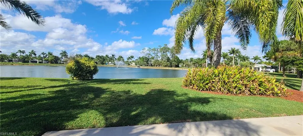 View of yard with a water view