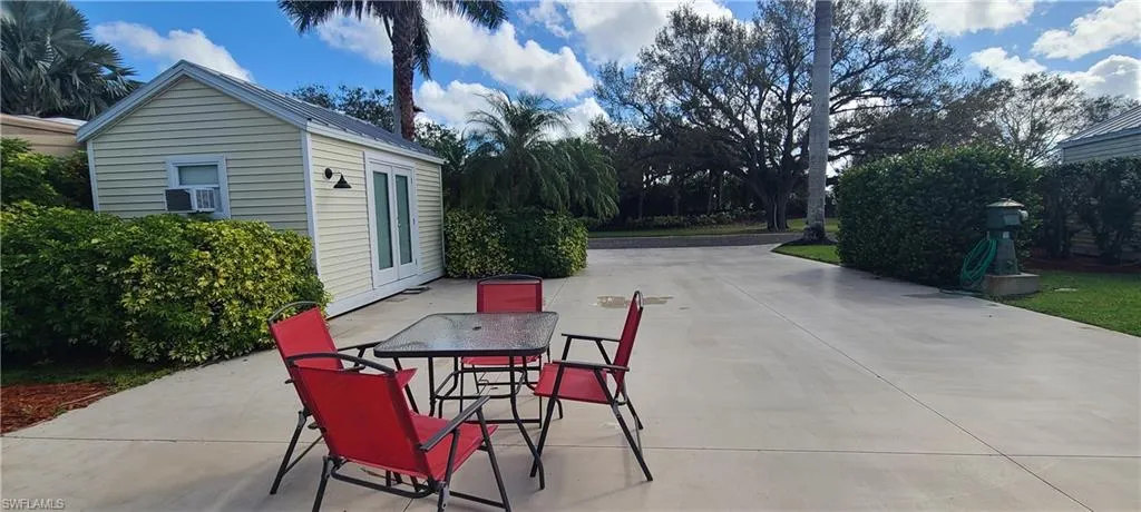 View of patio / terrace with an outdoor structure and cooling unit