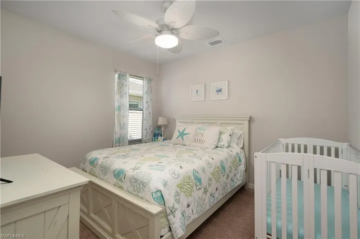 Bedroom featuring carpet flooring and ceiling fan