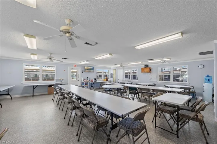Dining space featuring a textured ceiling and baseboards
