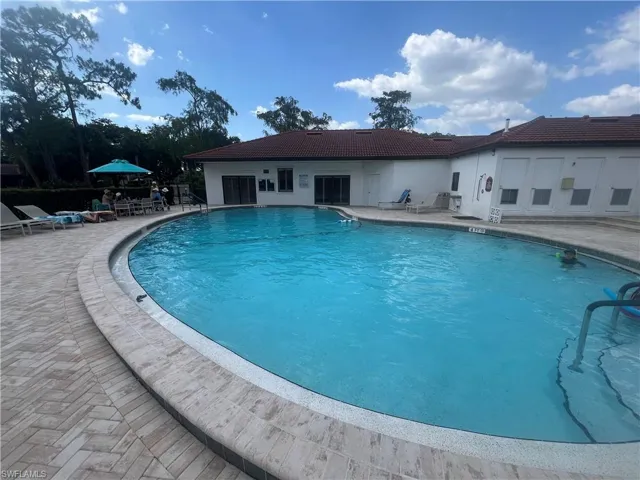 Community pool with a patio area