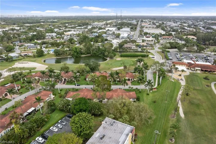 View of property location featuring a large body of water and a golf club