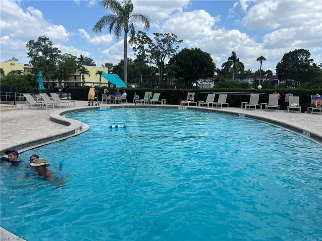 Community pool featuring a patio
