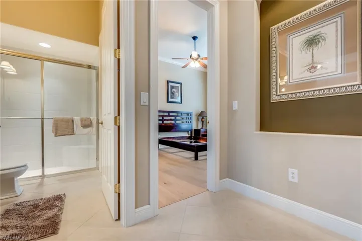 Corridor featuring light tile patterned floors