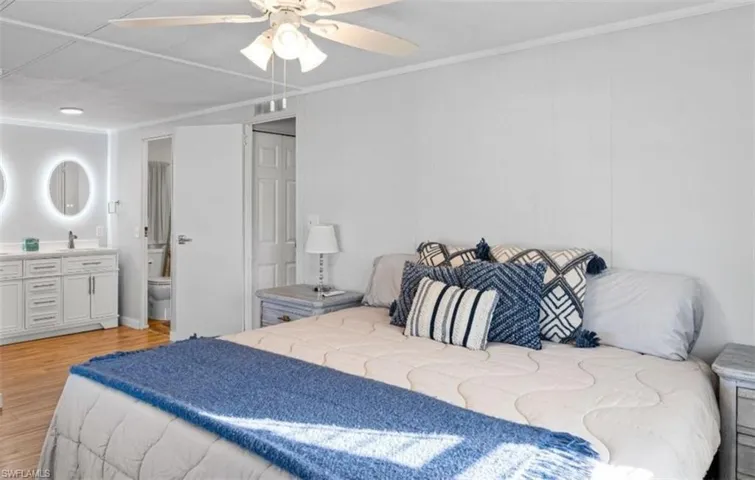 Bedroom featuring light wood-style floors and a ceiling fan