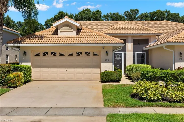 Mediterranean / spanish-style home featuring a garage