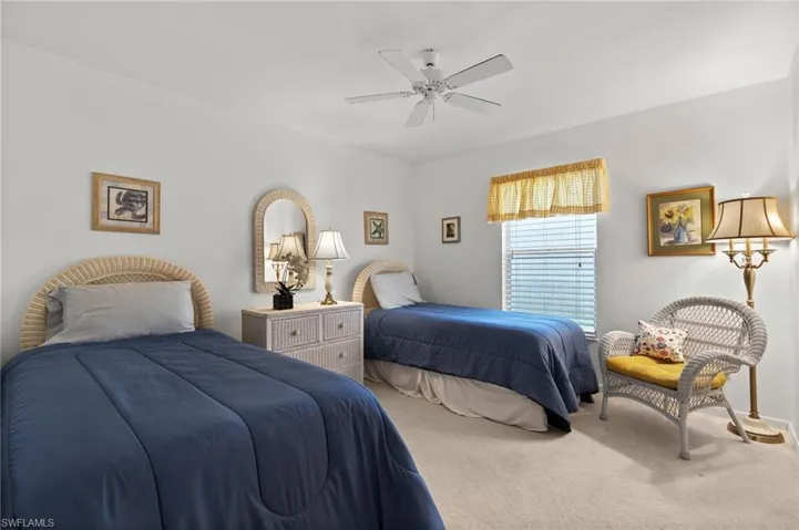 Bedroom featuring ceiling fan and carpet flooring