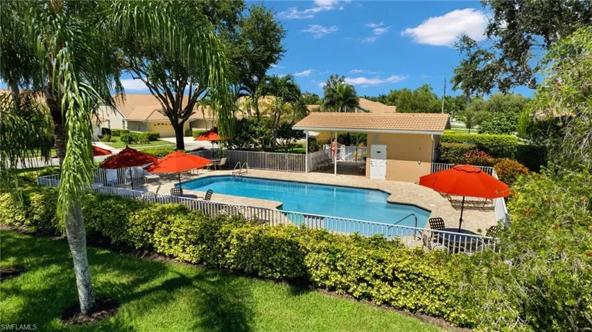 View of swimming pool with a yard and a patio area