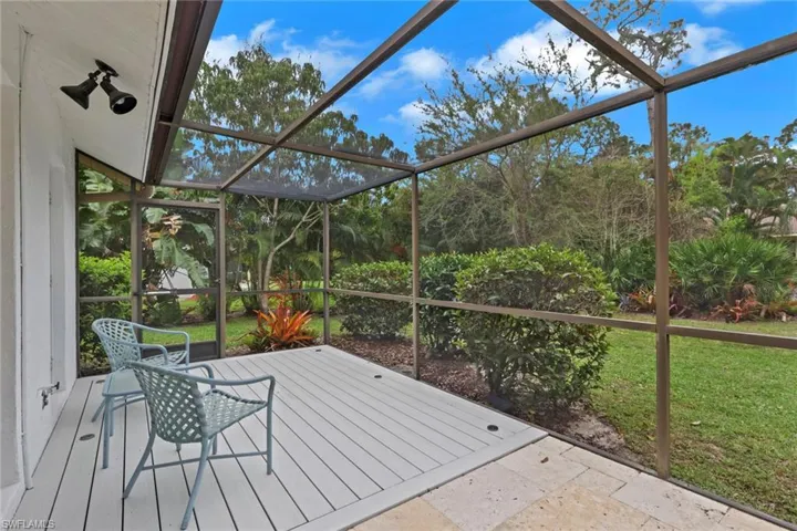 Screened Lanai looking into yard just off the guest bath