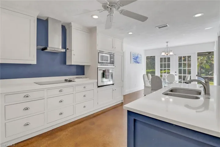 Kitchen boasts Custom European Wood Cabinetry, Deep Quartz Countertops, Recessed Lighting, UndermountHigh End GE Stainless Steel Appliances,