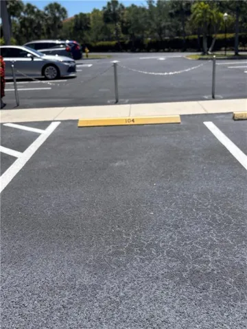 Paved parking space featuring a numbered parking block and white line markings