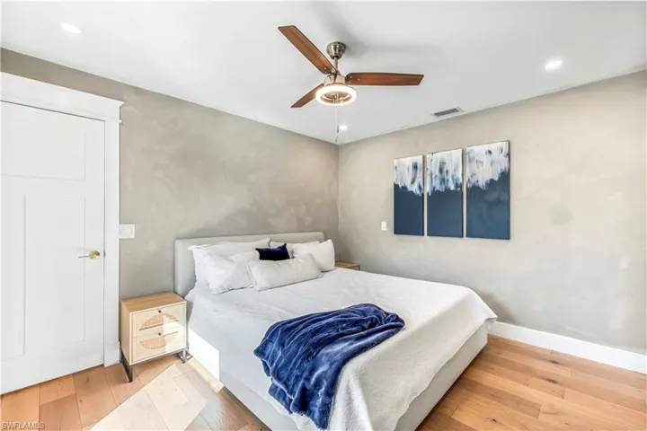 Bedroom with wood flooring and ceiling fan