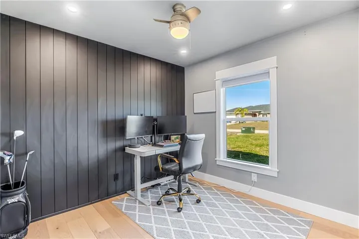 Guest bedroom with shiplap accent wall.
