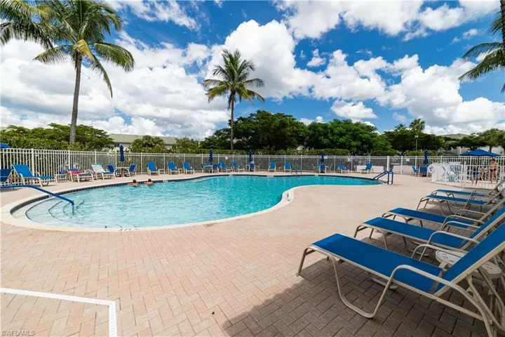 Swimming pool with integrated steps, surrounded by a paver deck