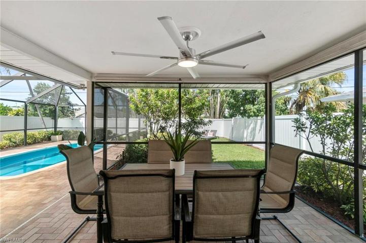 Fully covered outdoor dining area with upgraded fan and lighting.