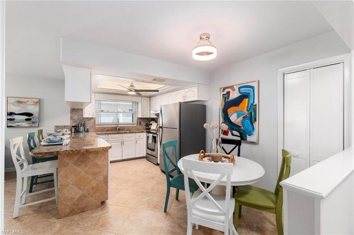 Open kitchen/din8ng area with convenient pantry closet.