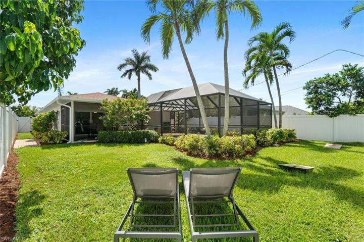 Spacious Green Area Around the Pool has tropical privacy with lush upgraded irrigated sod.