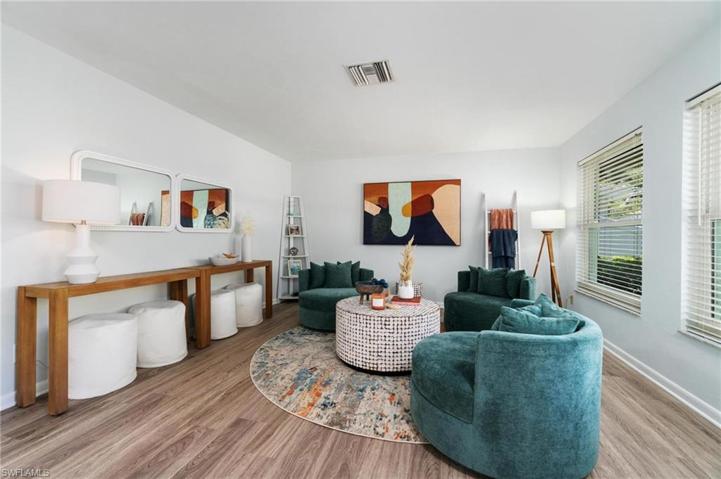 Freshly painted interior.  The Bonus front room is staged as a den.  Could make a convenient executive office.