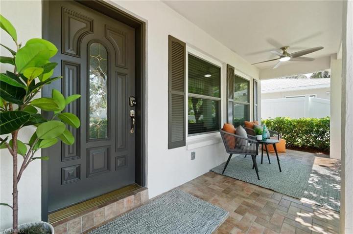 Front Patio has a new, modern exterior paint pallet with updated fan lighting and room for a seating area.
