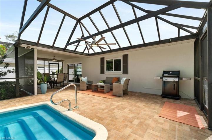 Back screened in pool Patio has 2 separate covered seating areas.