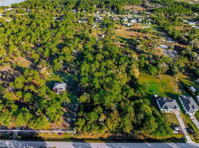 View of property location with nearby suburban area