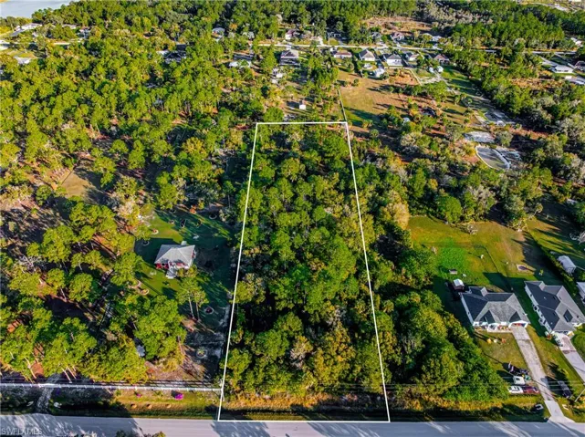 Aerial view of residential area with property boundaries highlighted