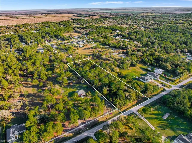 Aerial overview of property's location featuring property parcel outlined