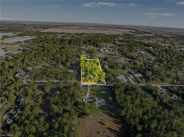 Aerial overview of property's location featuring property parcel outlined