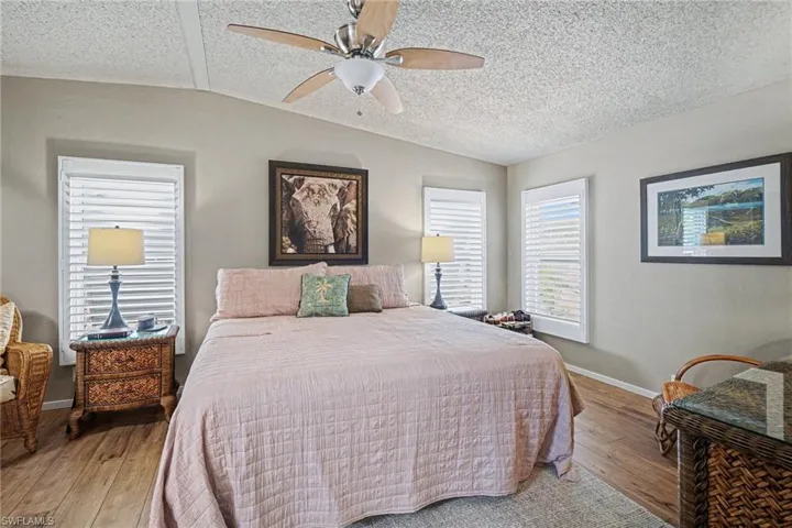 Bedroom featuring a ceiling fan and hardwood / wood-style floors