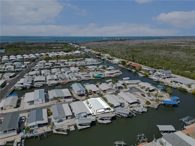 Aerial view of residential area with a nearby body of water