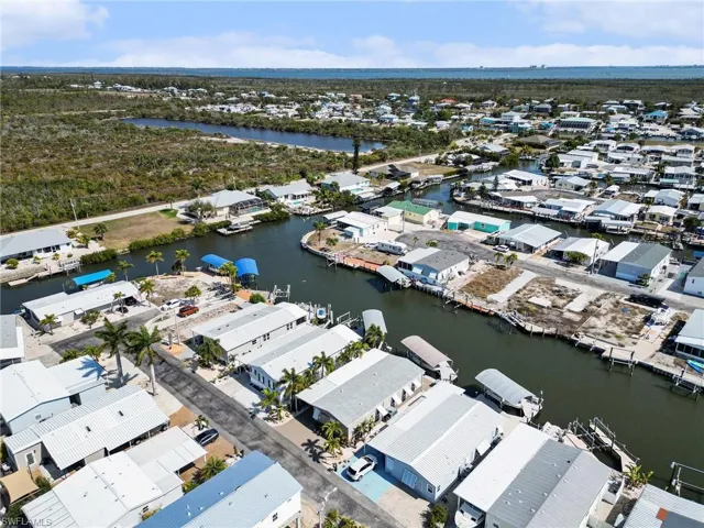 Aerial perspective of suburban area with a nearby body of water