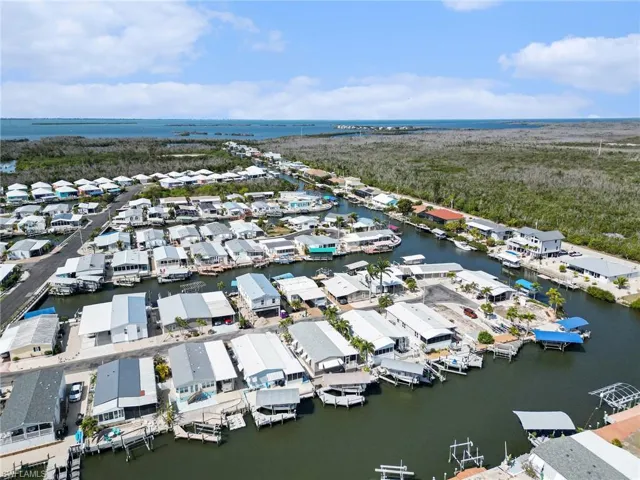 Aerial view of residential area with a large body of water