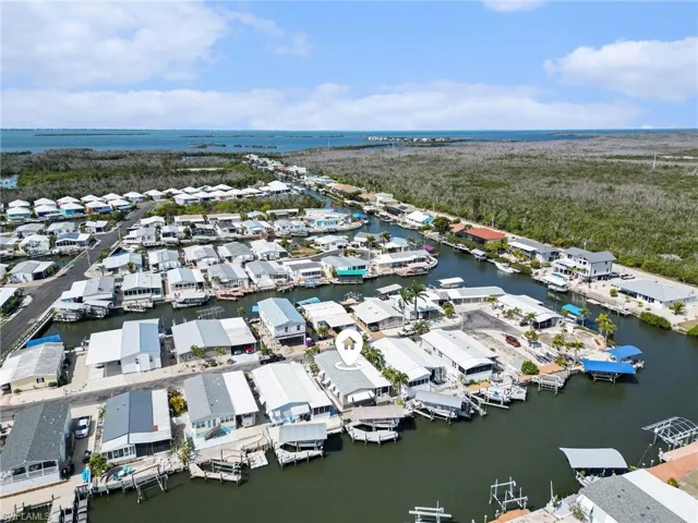 Aerial perspective of suburban area with a large body of water