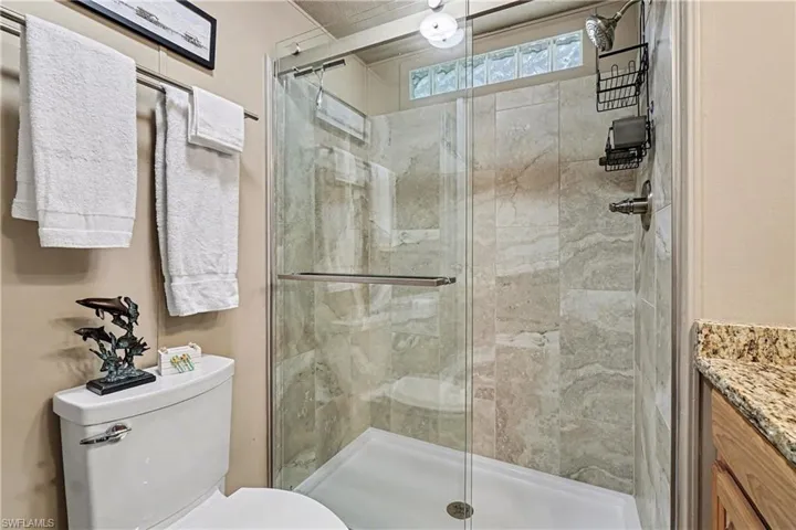 Bathroom with vanity and a stall shower